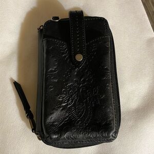 The Sak Silverlake Smartphone Wallet in Black Floral Embossed leather.